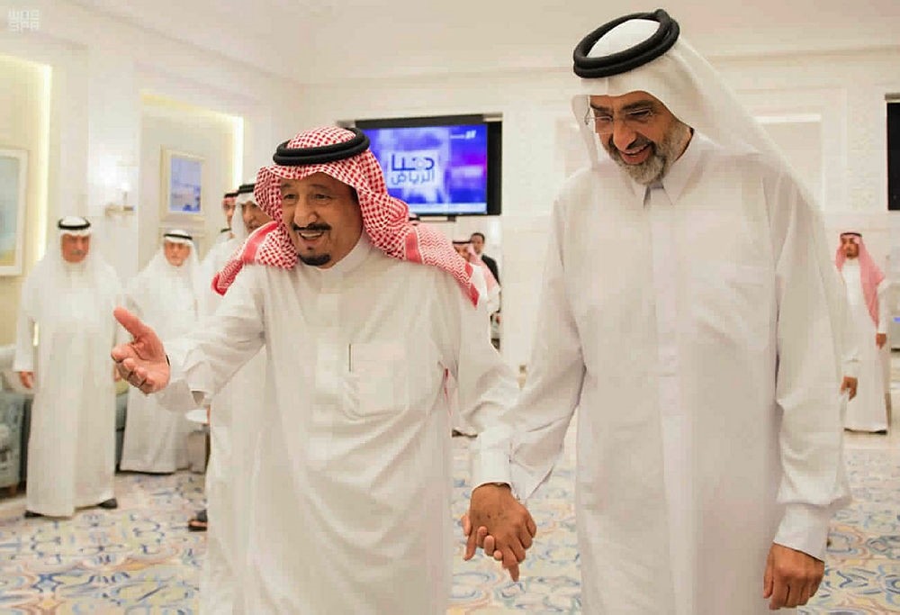 Saudi King Salman, left, walks with Qatari Sheikh Abdullah bin Ali Al Thani, right, at the monarch's vacation home in Tangiers, Morocco, on Aug. 17, 2017. (AP Photo)