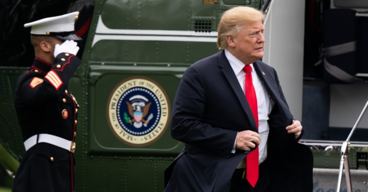 U.S. President Donald Trump walks from Marine One after arriving on the South Lawn of the White House in Washington, DC, May 17, 2019, following a one-night trip to New York. (AFP Photo)
