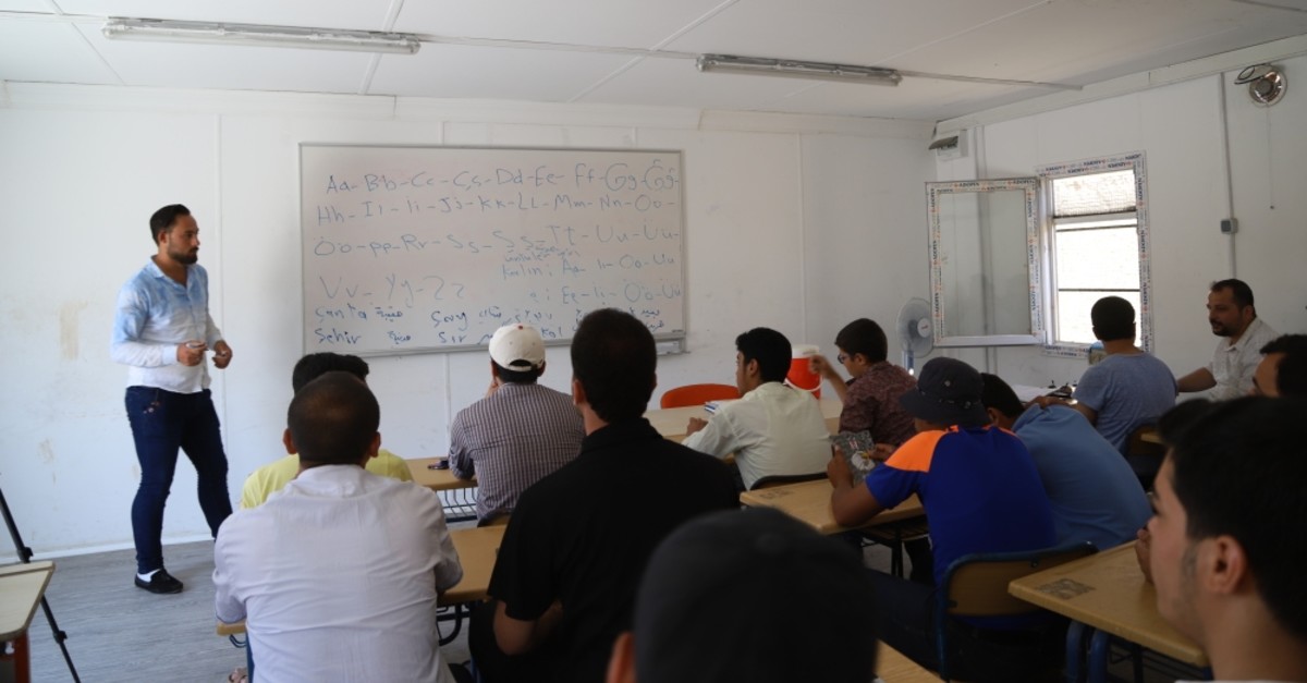 Syrians attend a Turkish language class in Mare, July 12, 2019.