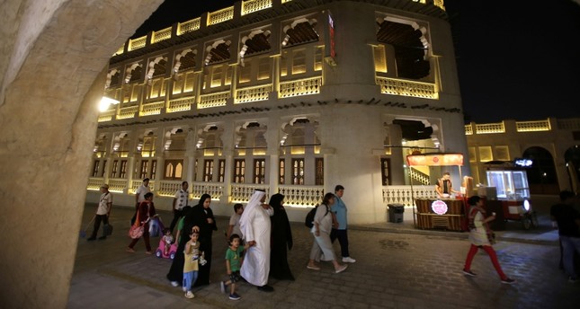 In this Thursday, May 3, 2018 photo, a Qatari family visit the Waqif Souq, or market, in Doha, Qatar. (AP Photo)