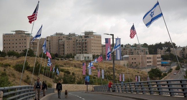 Security officers walk on a road leading to the US Embassy compound ahead the official opening in Jerusalem, Sunday, May 13, 2018. (AP Photo)