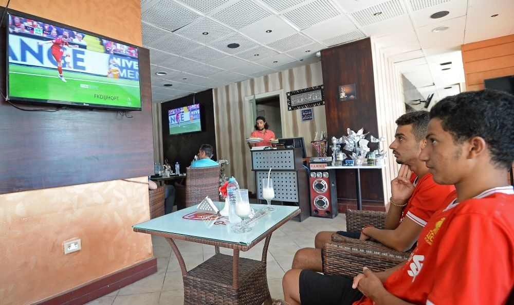 Egyptian Liverpool supporters watch the opening game of the English Premier League between Liverpool and West Ham at a restaurant in Cairo, on Aug. 12.