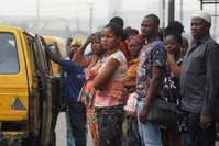 People are seen waiting for a bus at a bus stop, Lagos, Feb. 13, 2020. (REUTERS Photo)