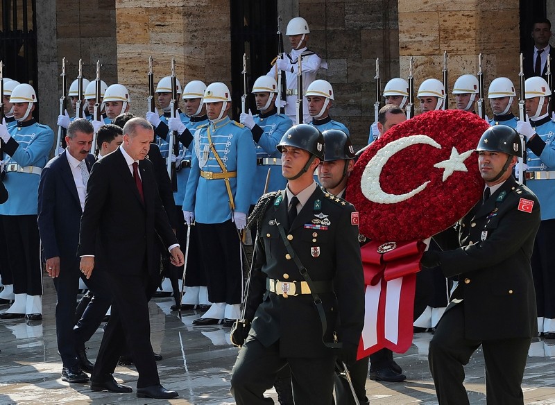 Erdoğan, left, walks for a wreath-laying ceremony at mausoleum of the nation's founding father Mustafa Kemal Atatürk, in Ankara,