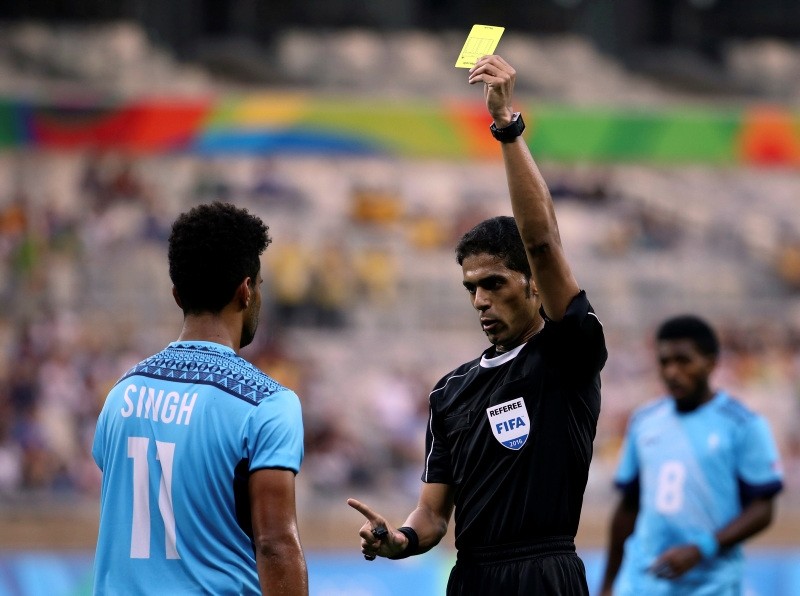 In this Aug. 10, 2016 file photo, Fiji's Alvin Singh is yellow carded by referee Fahad Al Mirdasi during a group C match of the men's Olympic football tournament between Germany and Fiji at the Mineirao Stadium in Belo Horizonte, Brazil. (AP Photo)