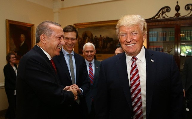 Erdoğan (L) and Trump shake hands during the meeting at the White House, May 16, 2017.