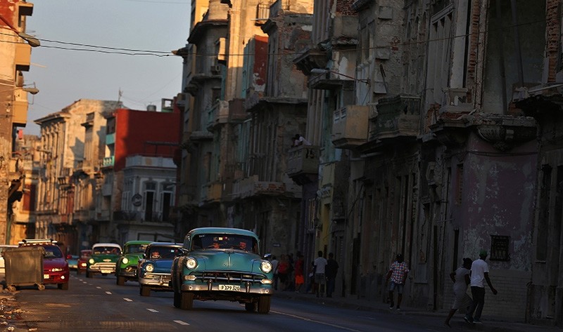 Classic cars drive down a road in Havana, Cuba (EPA Photo)