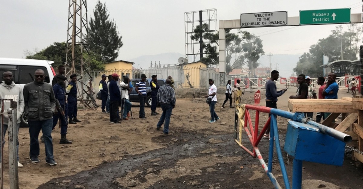 Congolese customs agents gather at the gate barriers at the border crossing point with Rwanda following its closure over Ebola threat in Goma, Democratic Republic of Congo, Aug. 1, 2019. (Reuters Photo)