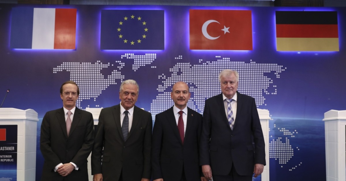 From L to R, Charles Fries, Franceu2019s envoy to Turkey, EU Commissioner for Migration Dimitris Avramopoulos, Interior Min. Su00fcleyman Soylu and German Interior Min. Horst Seehofer pose for photos following their news conference Ankara, Oct. 3, 2019. 