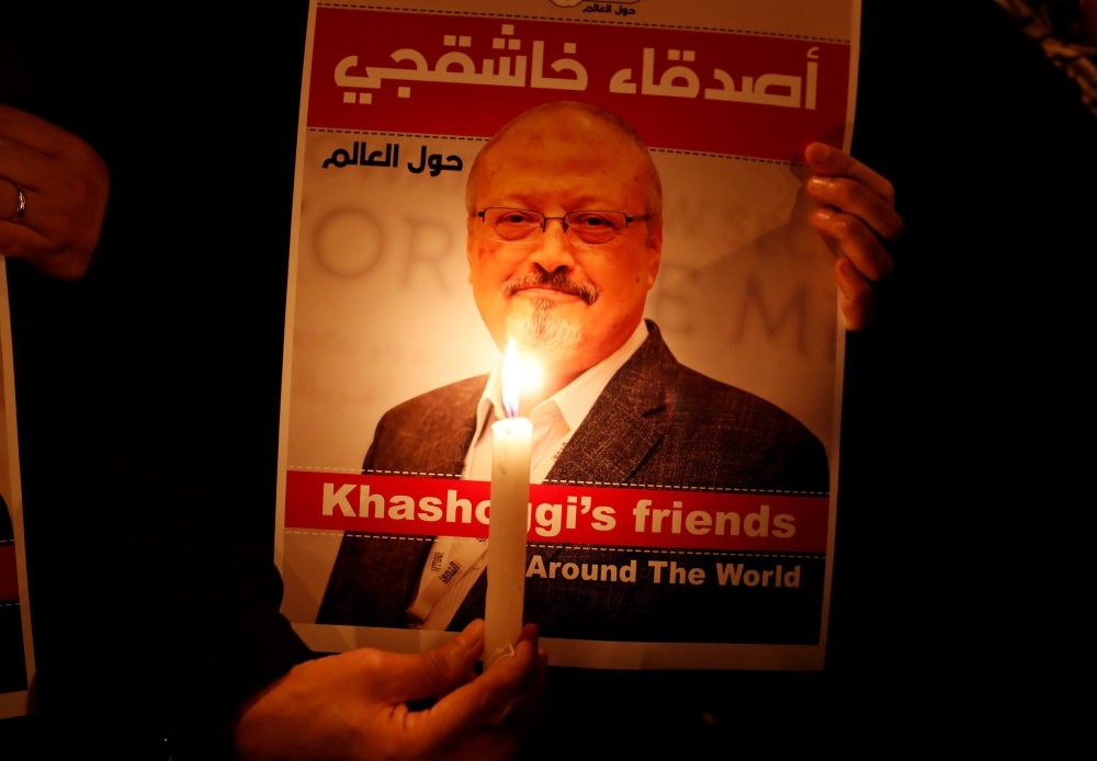 A demonstrator holds a poster with a picture of journalist Jamal Khashoggi outside the Saudi Consulate in Istanbul, Oct. 25.