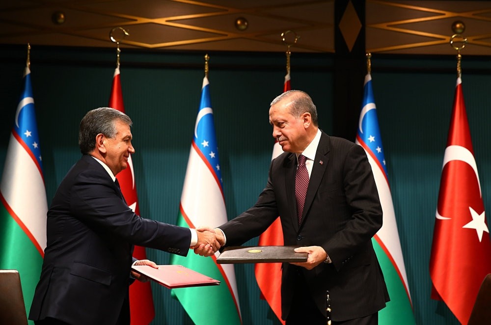 President Erdou011fan and his Uzbek counterpart Shavkat Mirziyoyev shake hands during a meeting to boost bilateral trade and diplomatic relations, Ankara, Oct. 25. 