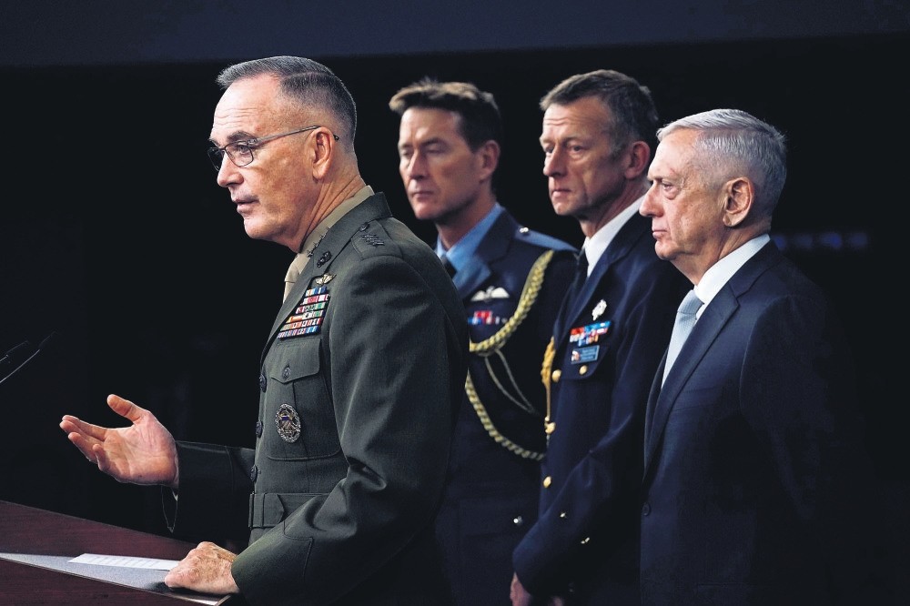 Chairmen of the Joint Chiefs of Staff Gen. Joseph Dunford (L) and U.S. Defence Secretary Jim Mattis (R) brief the media after U.S. President Donald Trump has ordered a joint force strike on Syria, April 13. 