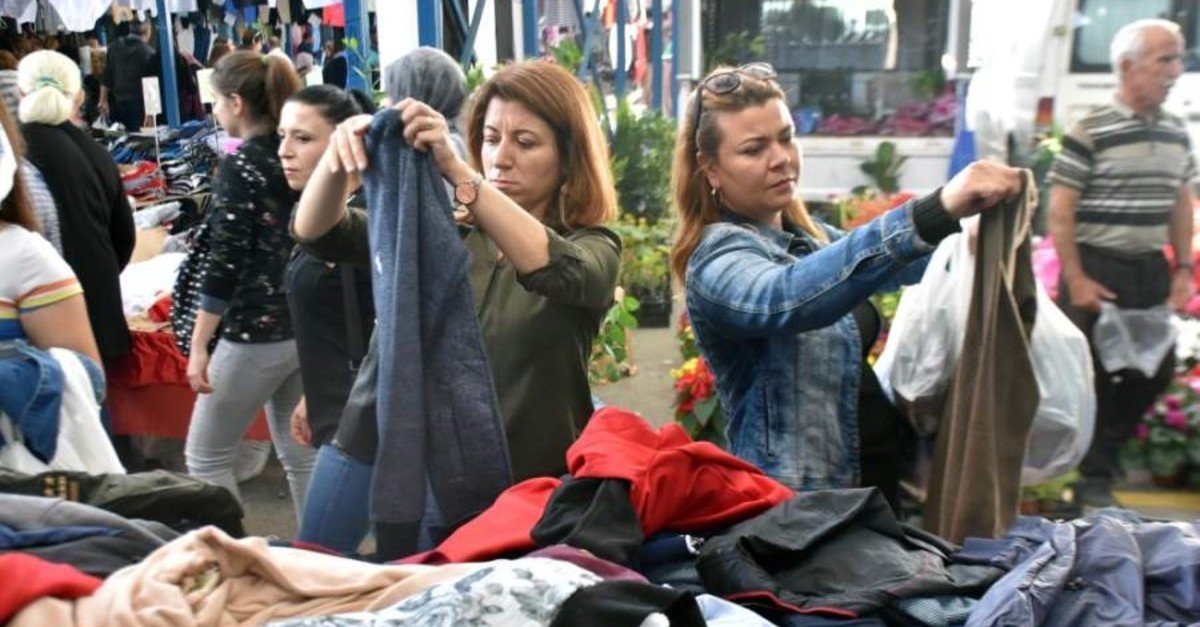 Tourists examine clothes at the local market in Edirne, Oct. 20, 2019. (DHA Photo)