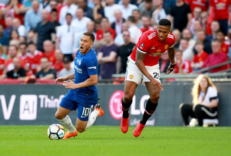 Chelsea's Edan Hazard and  Manchesters Antonio Valencia (R) in action during the FA Cup final match Chelsea vs Manchester United. (EPA Photo)