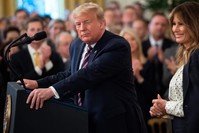 U.S. President Donald Trump winks alongside first lady Melania Trump as he speaks about his Senate impeachment trial in the East Room of the White House, Washington, D.C., Feb. 6, 2020. (AFP Photo)