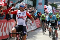 Caleb Ewan celebrates as he arrives at the finish line, April 19, 2019.