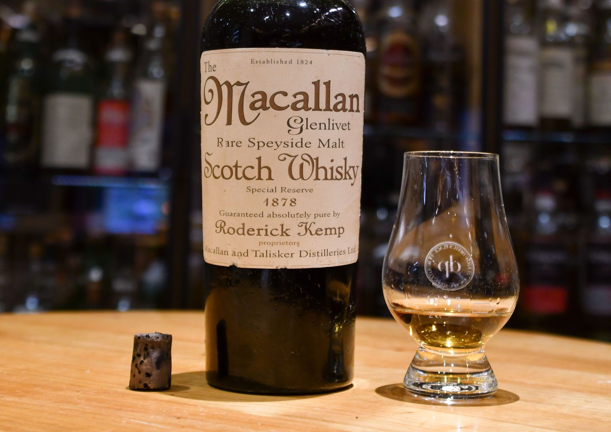 This file handout photo taken on August 2, 2017 by the Hotel Waldhaus am See in St. Moritz shows a bottle of whisky labeled to be made in 1878 by Scotch maker Macallan, at the hotel's Devil's Place Whisky Bar. (AFP Photo)