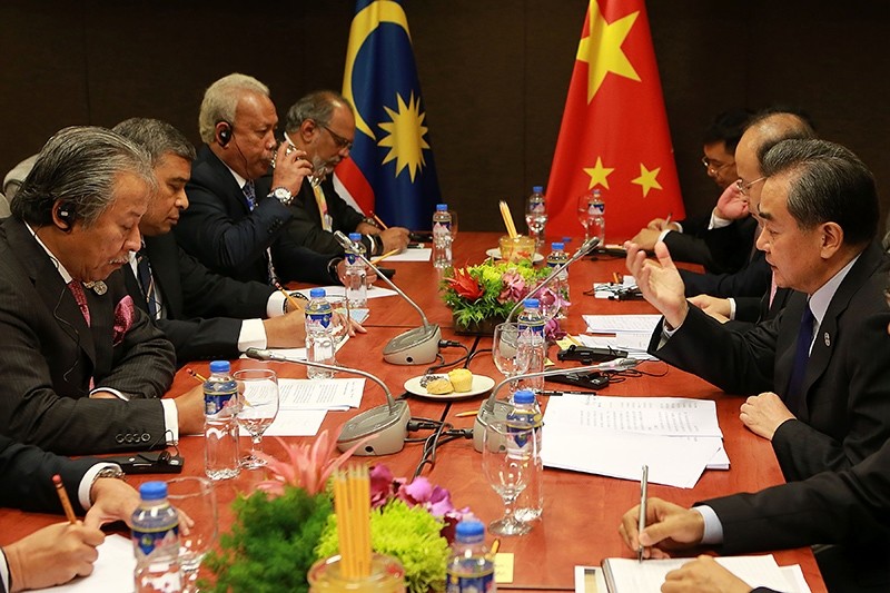 China's Foreign Minister Wang Yi (R) holds a bilateral meeting with Malaysia's Foreign Minister Anifah Aman on the sidelines of the 50th Association of Southeast Asian Nations (ASEAN) regional security forum in Manila on August 6, 2017. (AFP Photo)