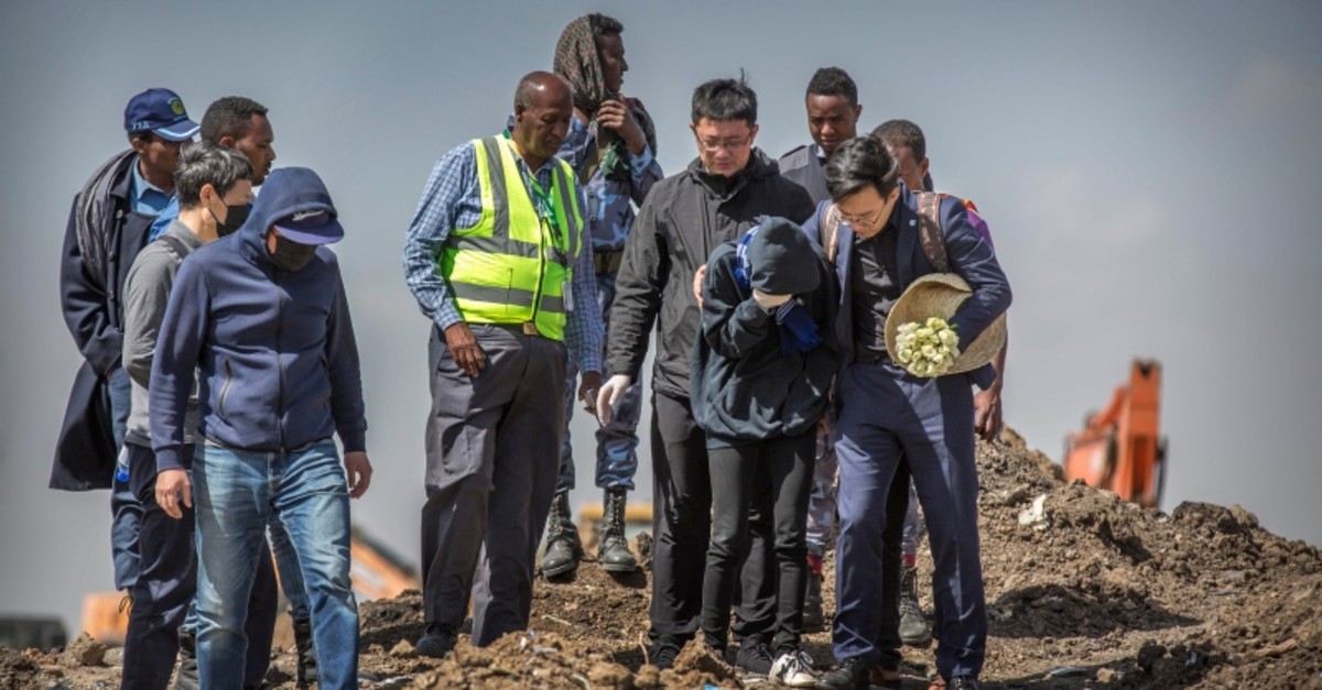 Chinese relatives of victims who died in the crash visit and grieve at the scene where the Ethiopian Airlines Boeing 737 Max 8 crashed, on Wednesday, March 13, 2019. (AP Photo)