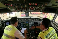 In this image from video taken on Tuesday, March 12, 2019, officials make inspection inside the cockpit of a Boeing 737 Max 8 aircraft is in hangar  at Garuda Maintenance Facility at Soekarno Hatta airport, Jakarta. (AP Photo)