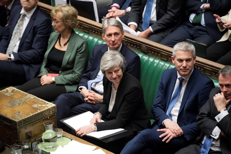 Prime Minister Theresa May attends a debate on Brexit 'plan B' in parliament, in London, Britain, January 29, 2019. Text in documents removed at source. (UK Parliament/Jessica Taylor/Handout via REUTERS)