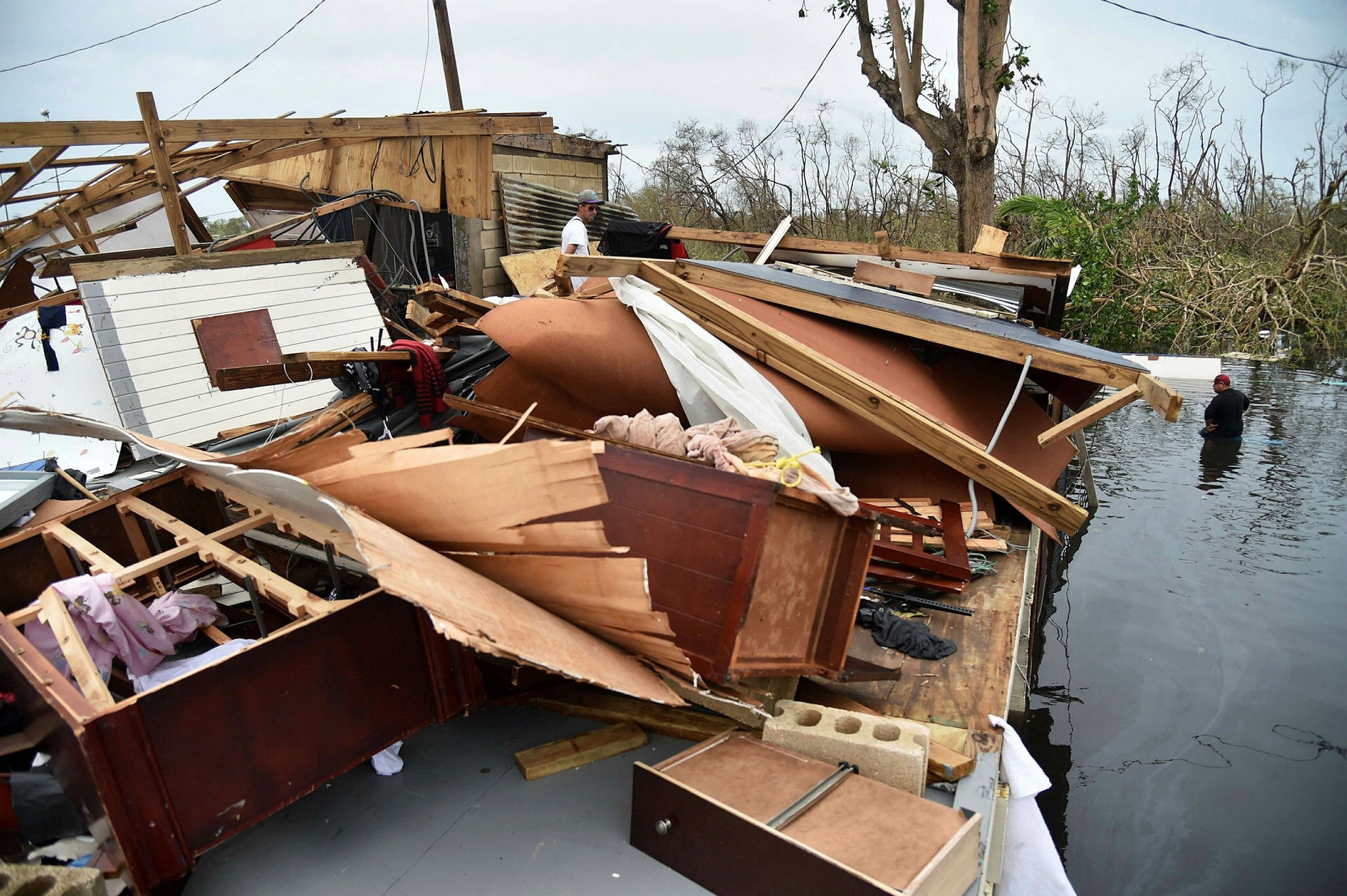 A man walks in his house which was destroyed by Hurricane Maria, in Catano town, Juana Matos, Puerto Rico, on September 21, 2017. (AFP Photo)