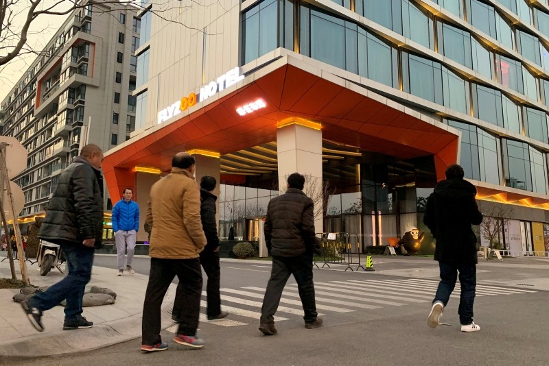 Men walk past Alibaba Group's futuristic FlyZoo hotel in Hangzhou, Zhejiang province, China Jan. 22, 2019 (Reuters Photo)