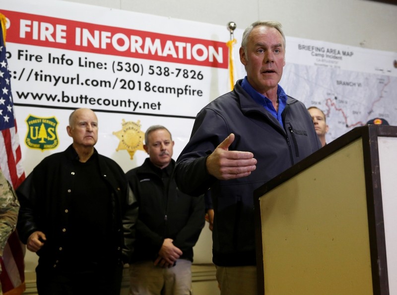 U.S. Secretary of the Interior Ryan Zinke, right, responds to a reporters question during a news conference held with California Gov. Jerry Brown, left, after touring the fire ravaged town of Paradise, Calif, Wednesday, Nov. 14, 2018. (AP Photo)