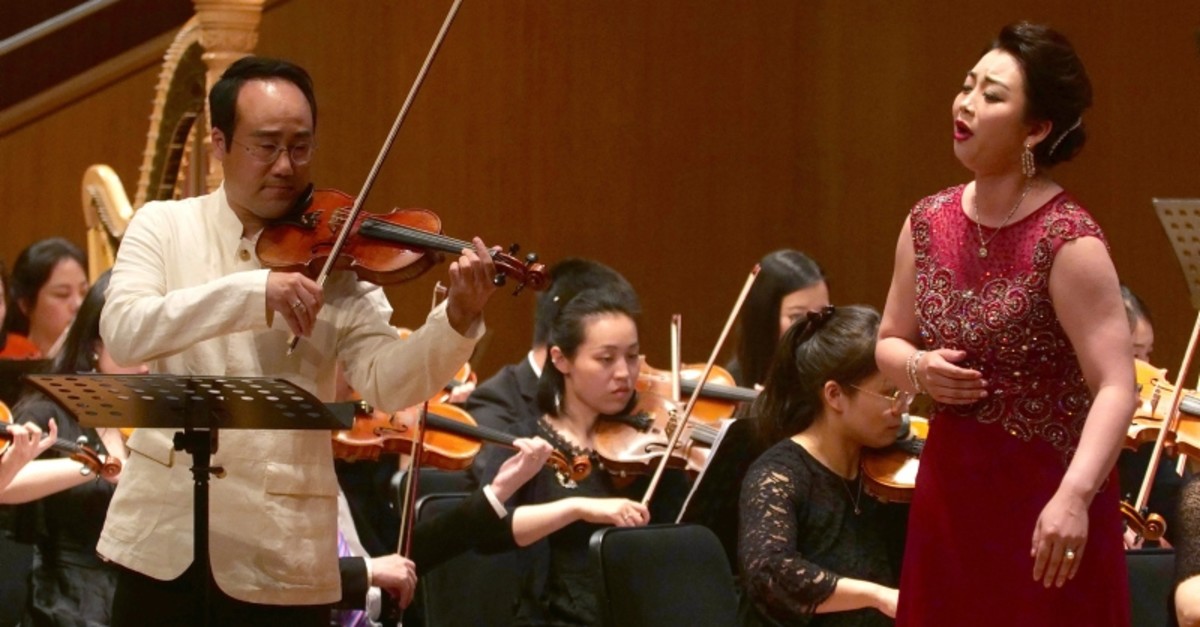 South Korean Violinist Won Hyung Joon and his North Korean soprano partner, Kim Song Mi perform at the Shanghai Oriental Arts Center in Shanghai on Sunday, May 12, 2019. (AP Photo)