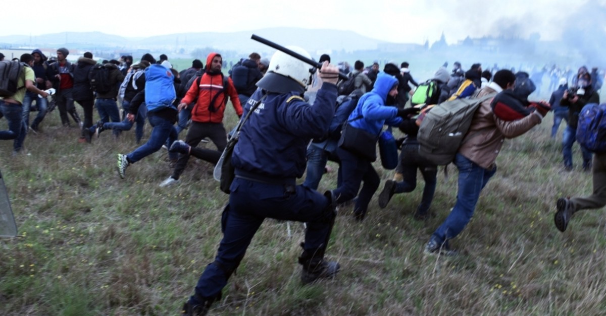 Riot police clash with protesting migrants outside a refugee camp in the village of Diavata, west of Thessaloniki, northern Greece, Saturday, April 6, 2019. (AP Photo)