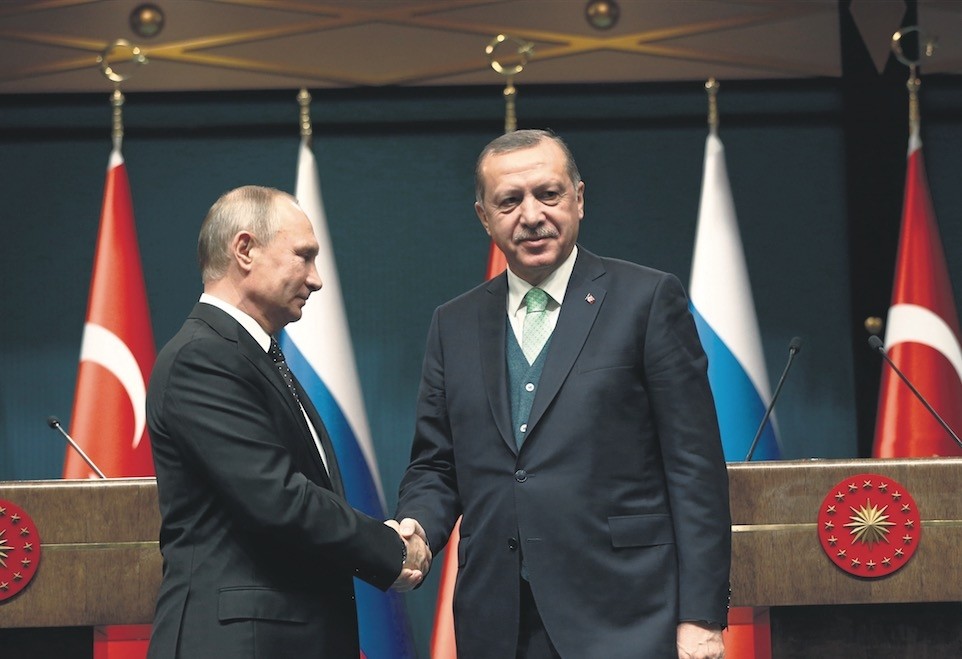 President Erdou011fan shakes hands with his Russian counterpart Putin following their meeting, at Presidential Complex, Ankara, Dec. 11.