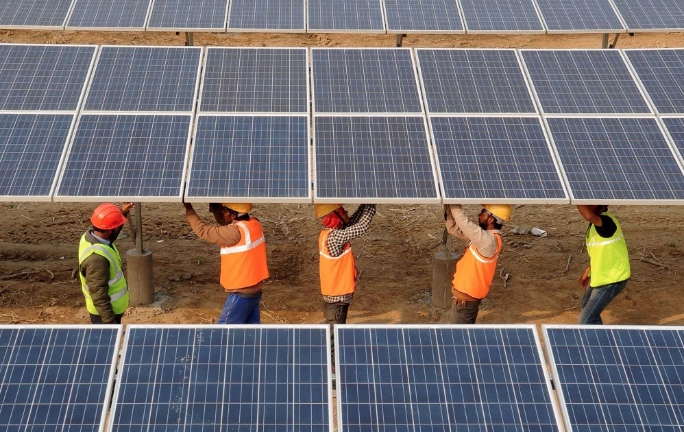 Indian workers construct part of the France-India Solar Direct Punjab Solar Park project in Muradwala, 30 kilometers from Fazilka.