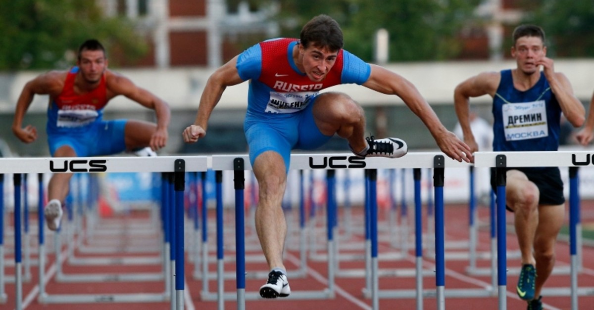 In this Thursday, July 28, 2016, file photo, world hurdles champion Sergei Shubenkov, center, competes during the Russian Stars 2016 track and field competitions in Moscow, Russia. (AP Photo)