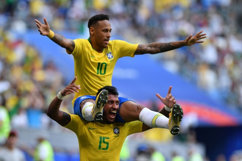 Brazil's forward Neymar celebrates with Brazil's midfielder Paulinho after scoring the opening goal during the Russia 2018 World Cup. (AFP Photo)