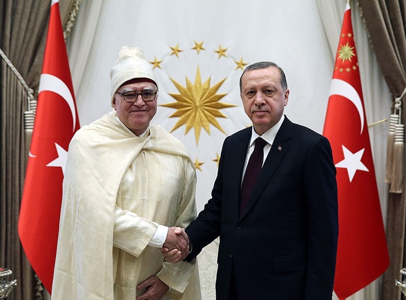 In this file photo on Jan. 18, 2017, President Recep Tayyip Erdou011fan receives newly appointed Moroccan envoy Menouar Alem (L) at the Beu015ftepe Presidential Complex in Ankara.