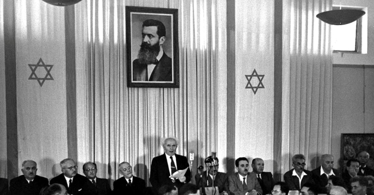 David Ben Gurion (C), Israel's first prime minister, declares independence for the State of Israel on May 15, 1948, which was made possible by a U.N. vote to partition Palestine, Nov.29, 1947.