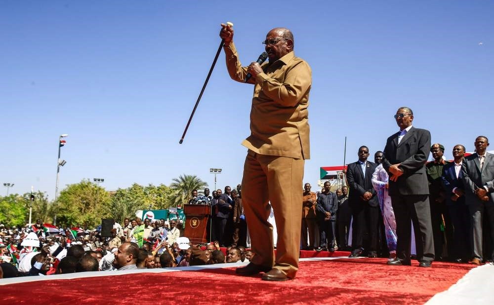 Sudan's President Omar al-Bashir speaks during a rally with his supporters in the Green Square, Khartoum, Jan. 9.