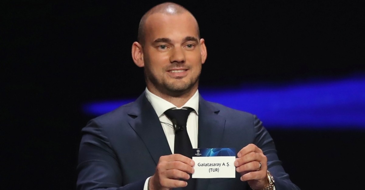 Former Galatasaray scorer Wesley Sneijder shows the name of the Lions during the UEFA Champions League group stage draw at the Grimaldi Forum, in Monaco, Thursday, Aug. 29, 2019. (AP Photo)