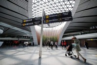 People walk through the terminal hall of the newly launched Daxing International Airport ahead of the 70th anniversary of the founding of the People's Republic of China, on the outskirts of Beijing, China, Sept. 28, 2019. (REUTERS Photo)