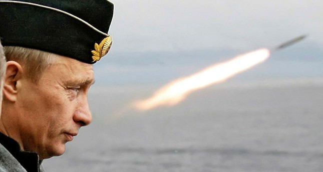 Putin watches the launch of a missile during naval exercises in Russia's Arctic North on board the nuclear missile cruiser Pyotr Veliky (Peter the Great) in this August 17, 2005 file photo.