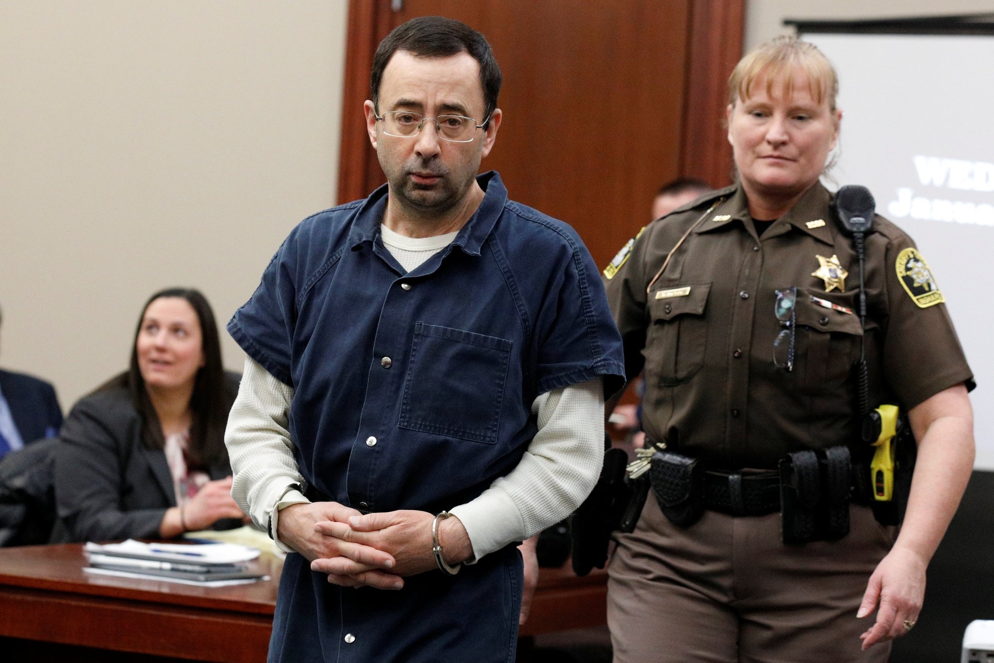 Larry Nassar, a former team USA Gymnastics doctor who pleaded guilty in November 2017 to sexual assault charges, is escorted by a court officer during his sentencing hearing in Lansing, Michigan, January 17, 2018. (REUTERS Photo)