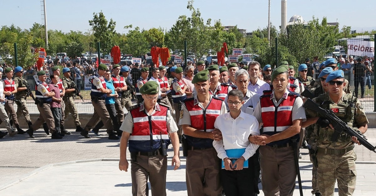 Gendarme troops escort Kemal Batmaz, one of the defendants, to the courthouse in this 2017 photo.