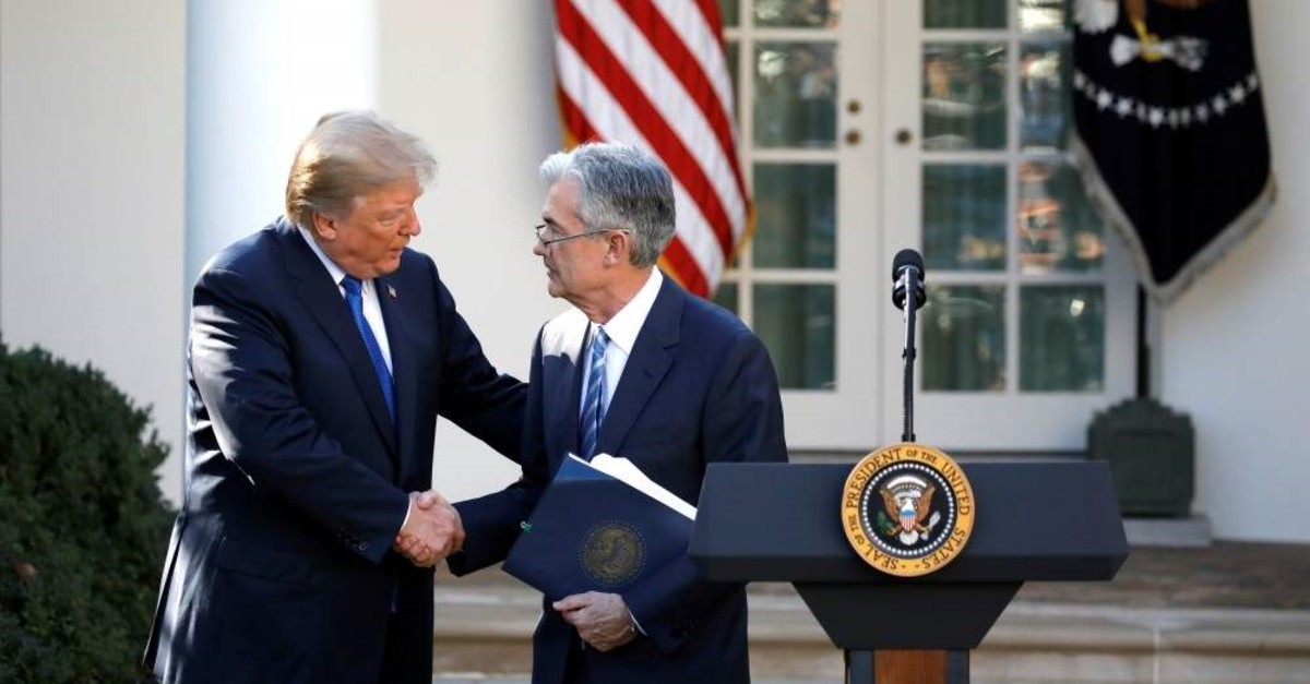 In this file photo, U.S. President Donald Trump shakes hands with Jerome Powell, then his nominee to become chairman of the U.S. Federal Reserve at the White House, Washington, U.S., Nov. 2, 2017. 