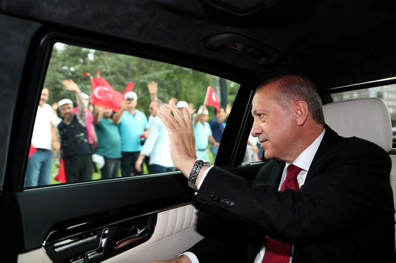 This hand out picture taken and released on July 9, 2018 by Turkish President Office shows President Recep Tayyip Erdoğan waving as he arrives at the Grand National Assembly of Turkey (TBMM) to take oath of office in Ankara. 