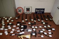 An Italian police display shows a large arsenal of weapons seized in raids on neo-Nazi sympathizers, Turin, July 15, 2019.
