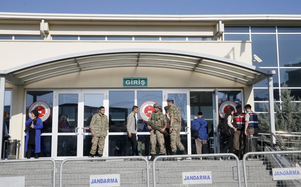 Soldiers stand guard outside a courthouse in Istanbul's Silivri district where pro-coup soldiers accused of killing 34 people are being tried.