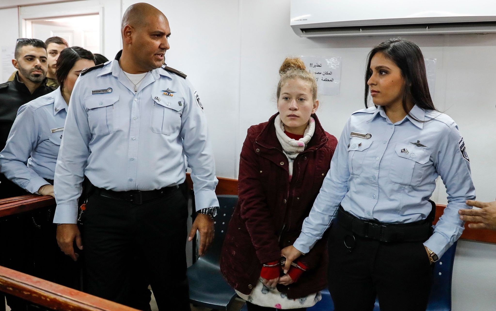 Ahed Tamimi (2nd-R), a 17-year-old prominent Palestinian campaigner against Israel's occupation, appears at a military court at the Israeli-run Ofer prison in the West Bank village of Betunia on December 25, 2017. (AFP Photo)