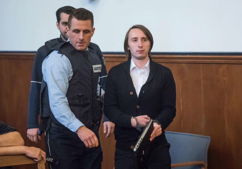 The German-Russian suspect, known as Sergei W, who is accused of having carried out a bomb attack on the Borussia Dortmund football team's bus, arrives for his trial on January 08, 2018 at the district courthouse in Dortmund, Germany (AFP Photo)