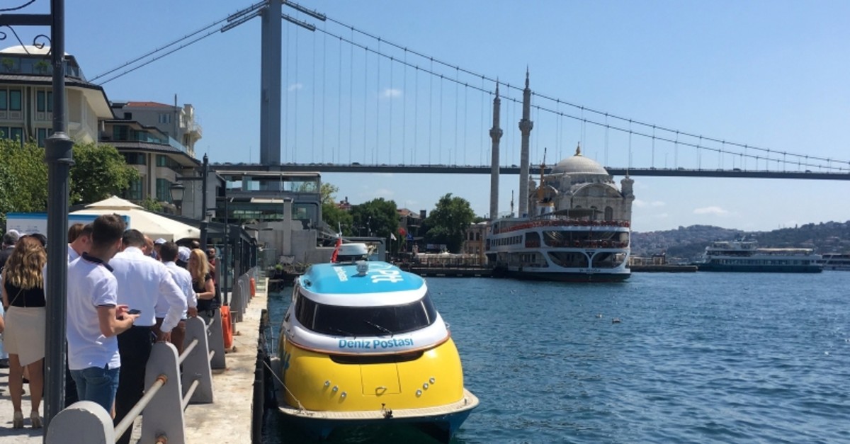 A sea postal services vessel is seen off the Marmara Sea near Istanbul's Ortaku00f6y coast and the Bosporus Bridge (IHA Photo)