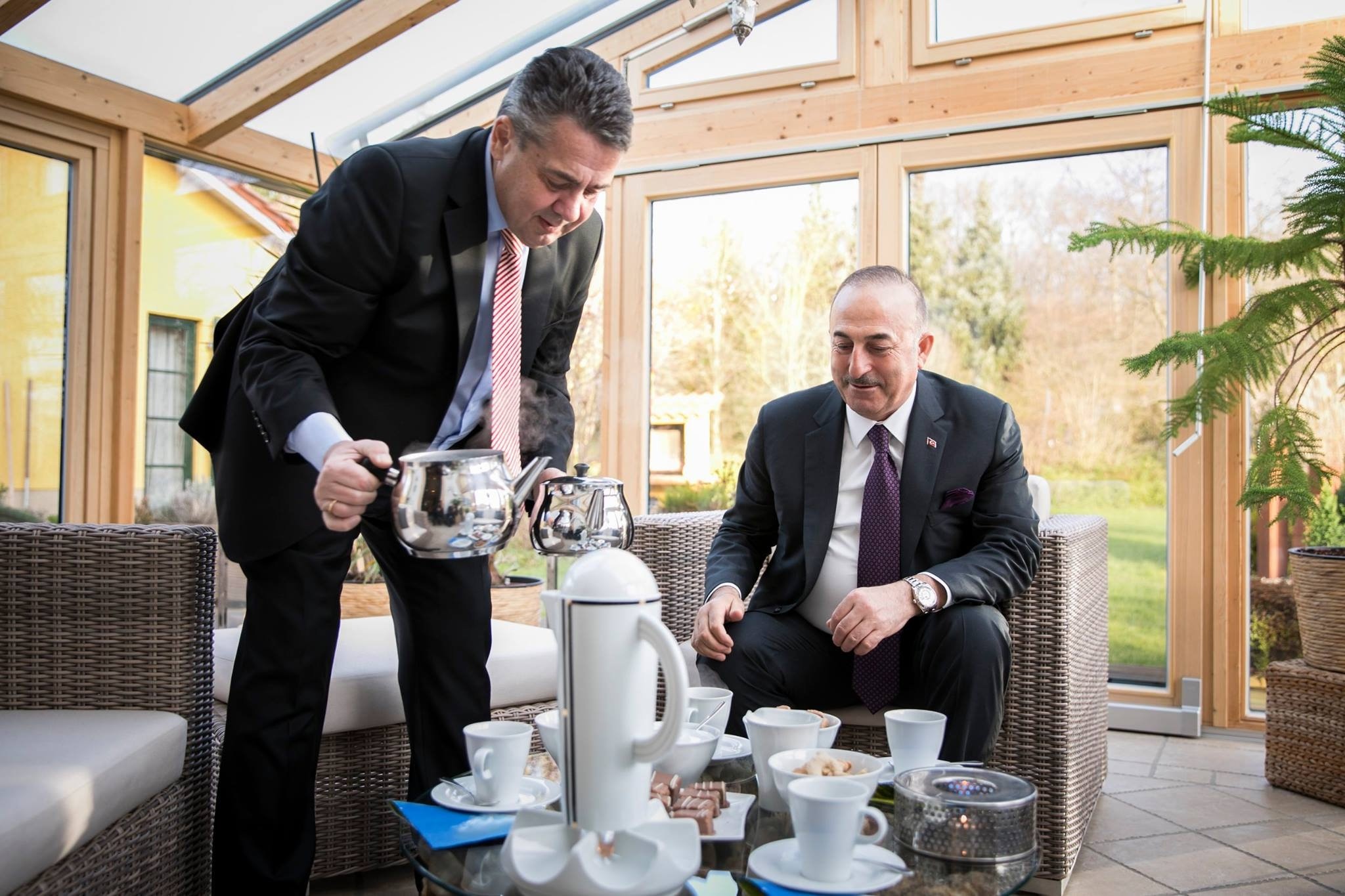 German Foreign Minister Sigmar Gabriel pouring Turkish tea for Foreign Minister u00c7avuu015fou011flu in Gabrielu2019s residence in his hometown Goslar, a central German city, Jan. 6.